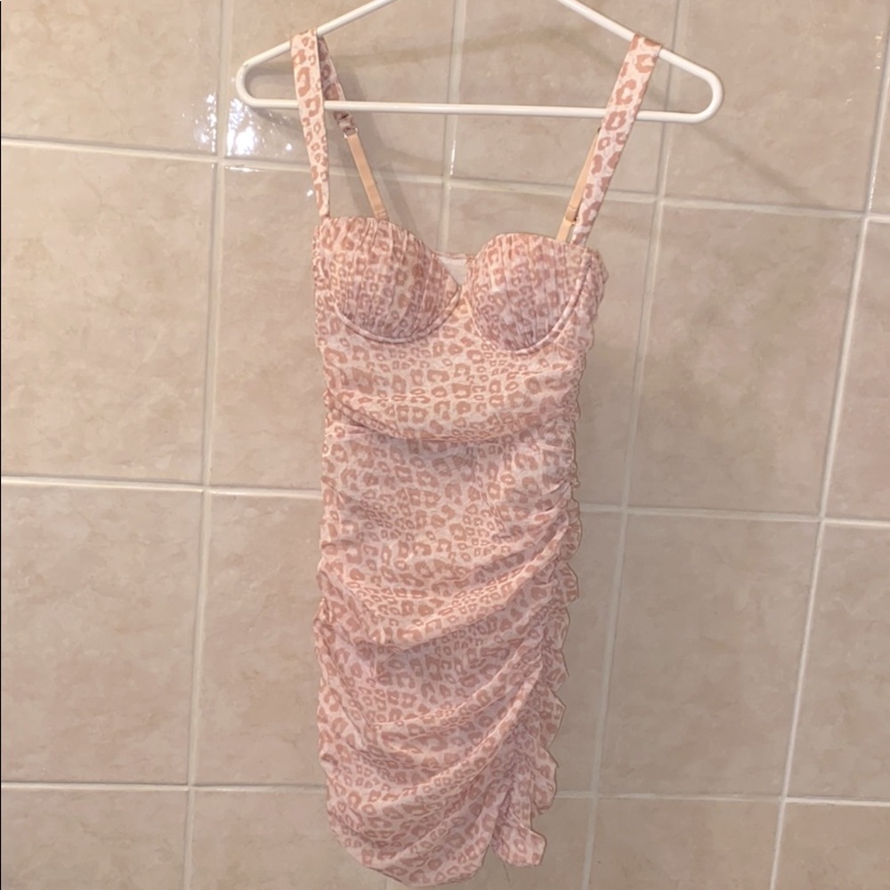 Animal Instinct Leopard Print Ruched Mini Dress.